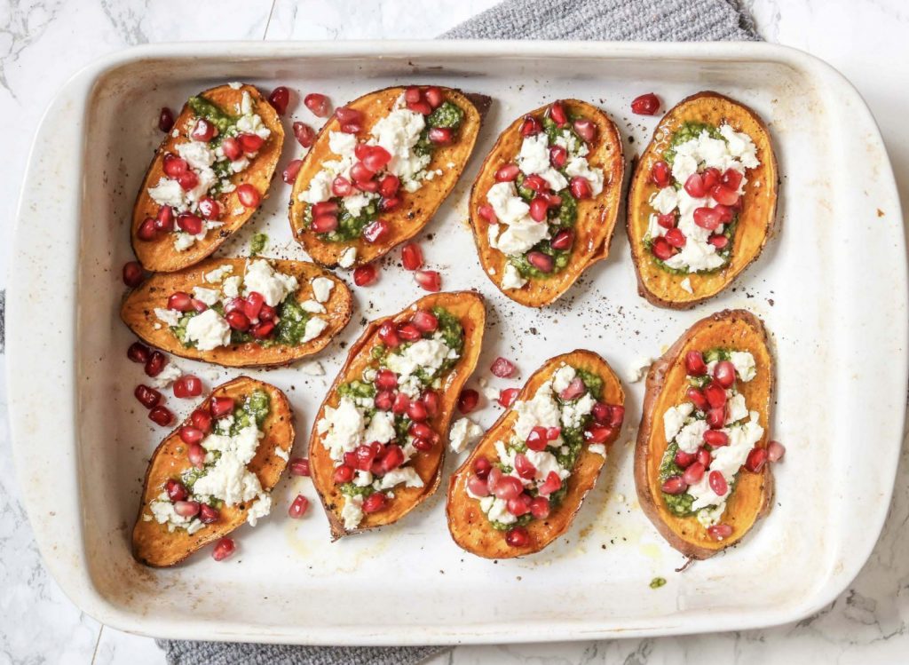 BAKED SWEET POTATO WITH FETA, PESTO AND POMEGRANATE